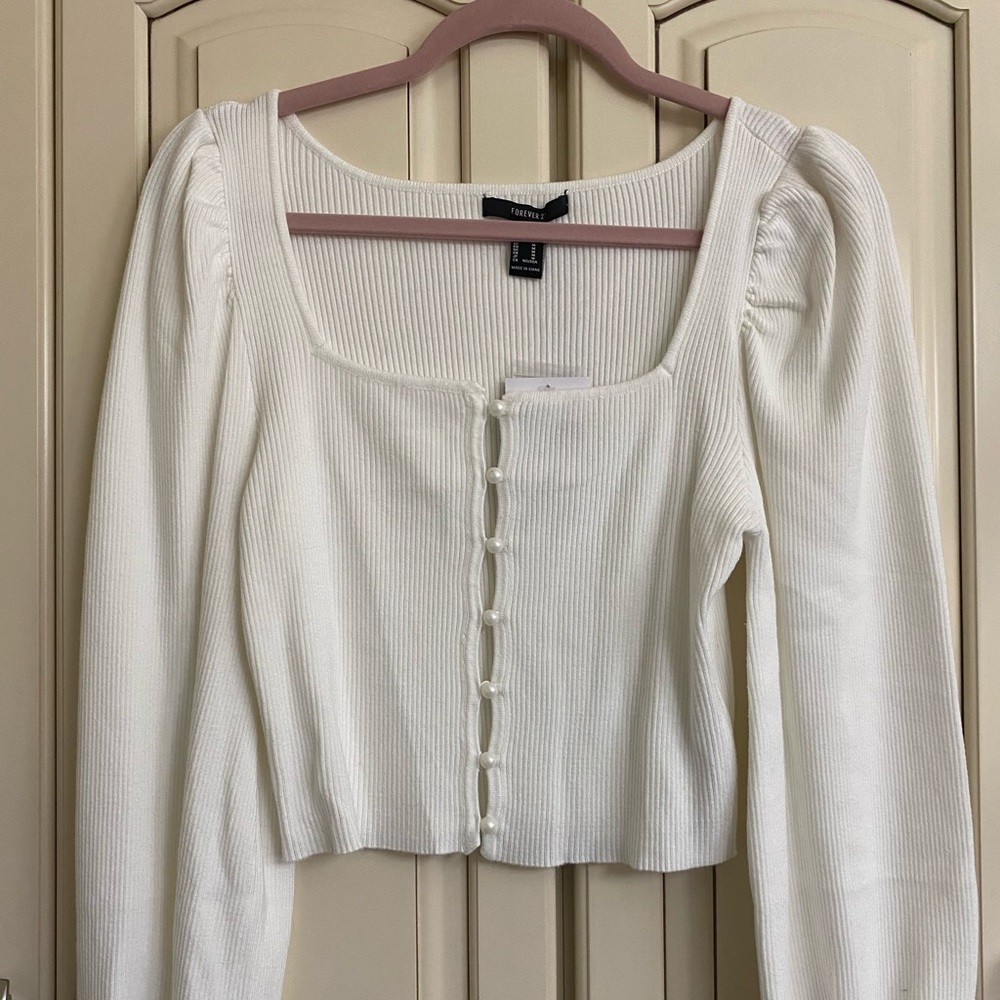 A Forever 21 white king sleeve blouse. Size medium